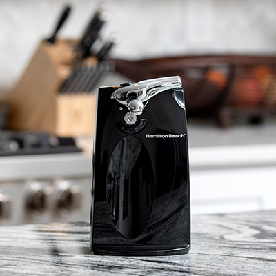 HAMILTON BEACH<sup>&reg;</sup> Sure Cut™ Can Opener - This durable, extra-tall can opener stands 9&quot; high. The SureCut™ technology is designed to open cans on the first try. Features include a removable, washable cutting unit, knife sharpener, and cord storage.