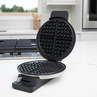 CUISINART<sup>&reg;</sup> Round Classic Waffle Maker - Enjoy delicious waffles with this stainless steel waffle maker.  With nonstick plates, five browning settings, a weighted lid, and dual indicator lights you can create restaurant-quality results right at home.  Measures: 7.88&quot; x 9.69&quot; x 3.31&quot;.