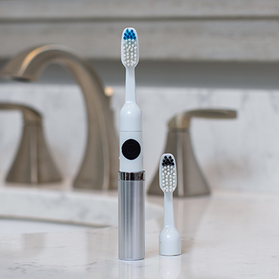 VIVITAR<sup>&reg;</sup> Ultrasonic Toothbrush - This compact and lightweight, battery operated toothbrush performs 22,000 strokes per minute for quality teeth care.  Features include 6 replaceable brush heads, cap for protecting germs and bacteria, and one AAA battery.