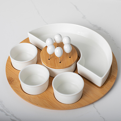 TOSCANA<sup>&reg;</sup> Symphony Appetizer Serving Tray Set - Perfect for your next get together. Set includes a beautiful 11.5&quot bamboo base tray with (1) half circle bowl, (3) assorted dip/ snack bowls and (6) cocktail picks. Bowls and cocktail pick handles are made of white porcelain. The set also includes a center cocktail pick dispenser with a bamboo lid.  